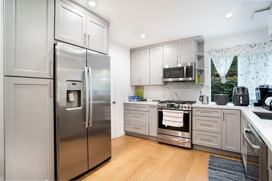 Contemporary kitchen interior featuring stainless steel appliances and sleek cabinetry.